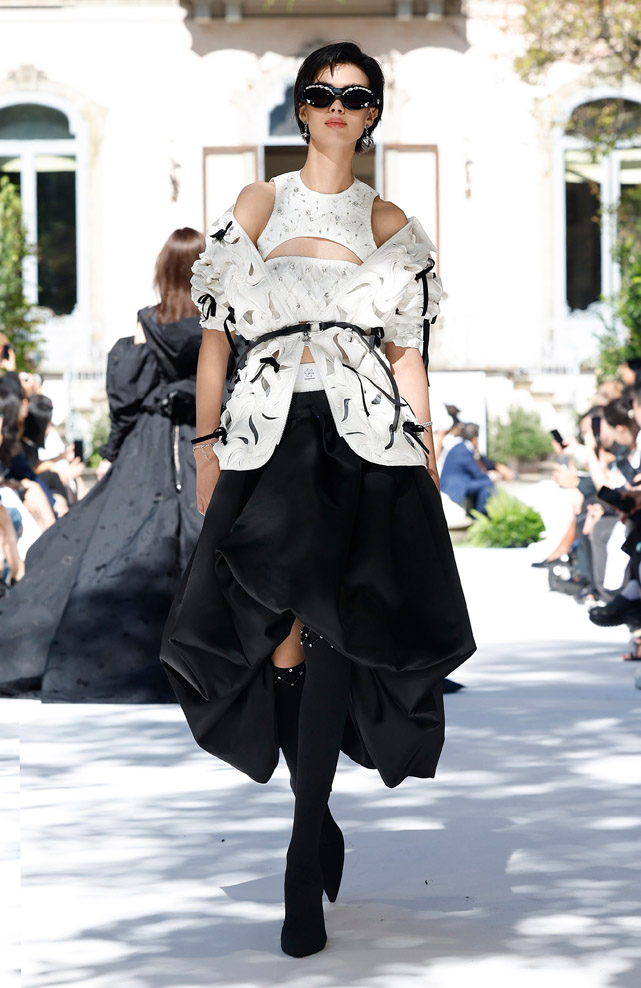 Olympic Champion Eileen Gu walks for Bosideng at Milan Fashion Week.