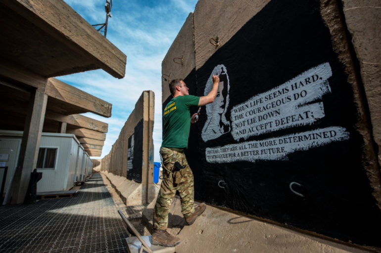 Cpl Nick Johns, Photographer, Sapper Adam Williams Painting A Blast Wall, Camp Taji, Iraq, On Operation Shader 3, April 2016. © Nick Johns.